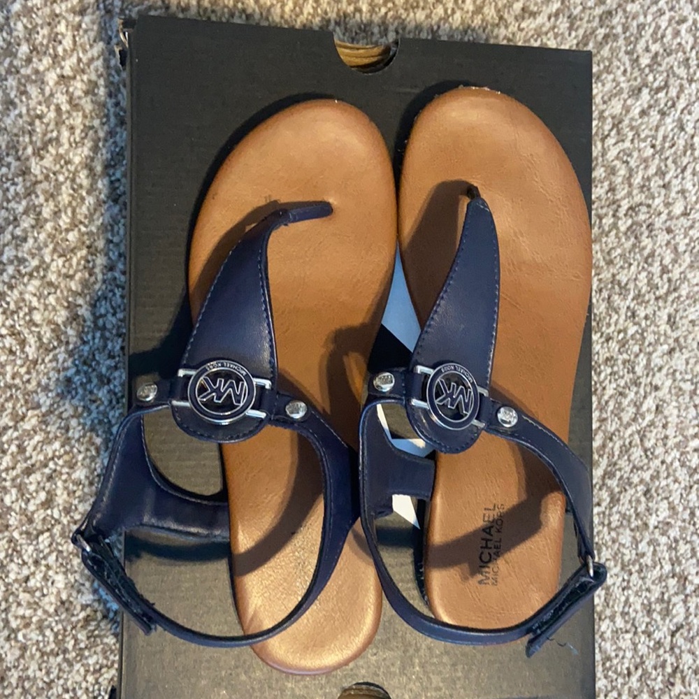 Gently used, size 4 Michael Kors Velcro sandals.